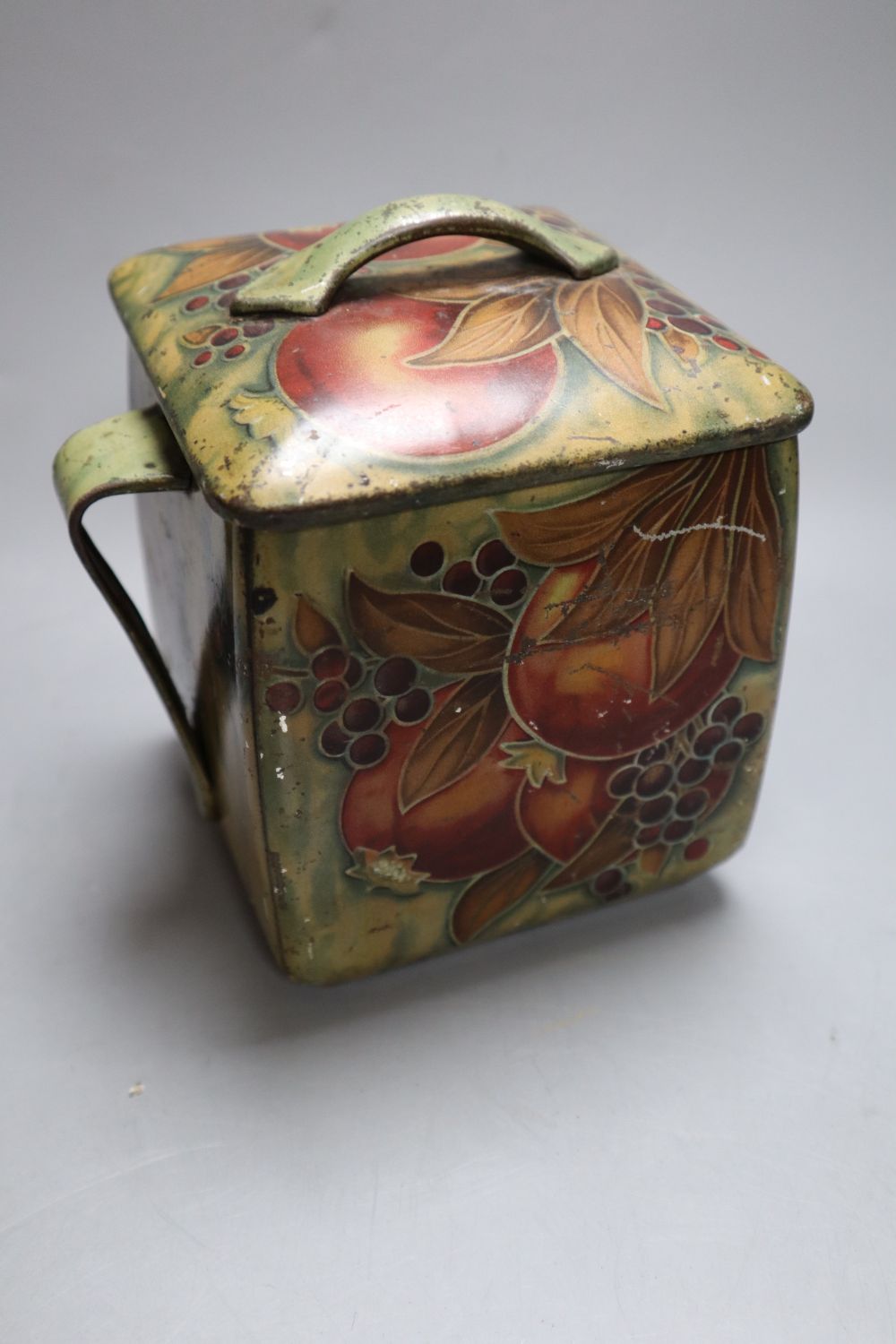 Two Jacobs biscuit tins, embossed coffer, 16cm wide and a Pomegranate design after Moorcroft and one other biscuit tin